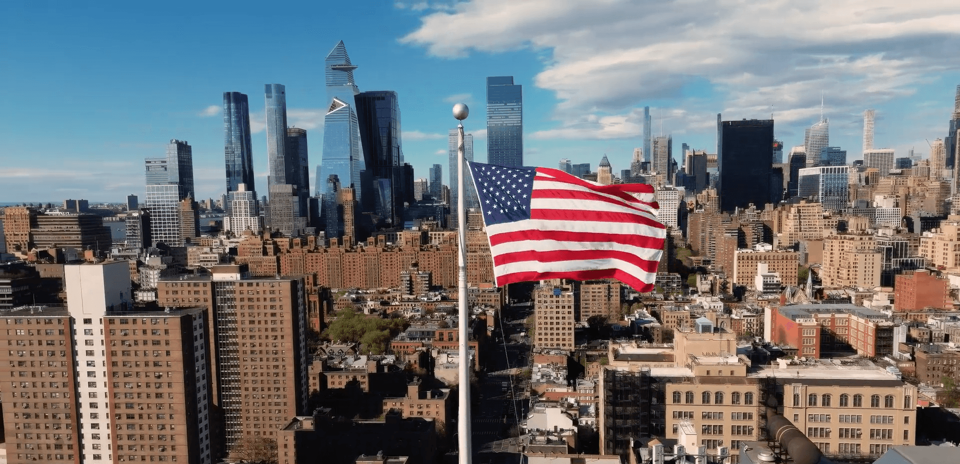 American flag with city skyline