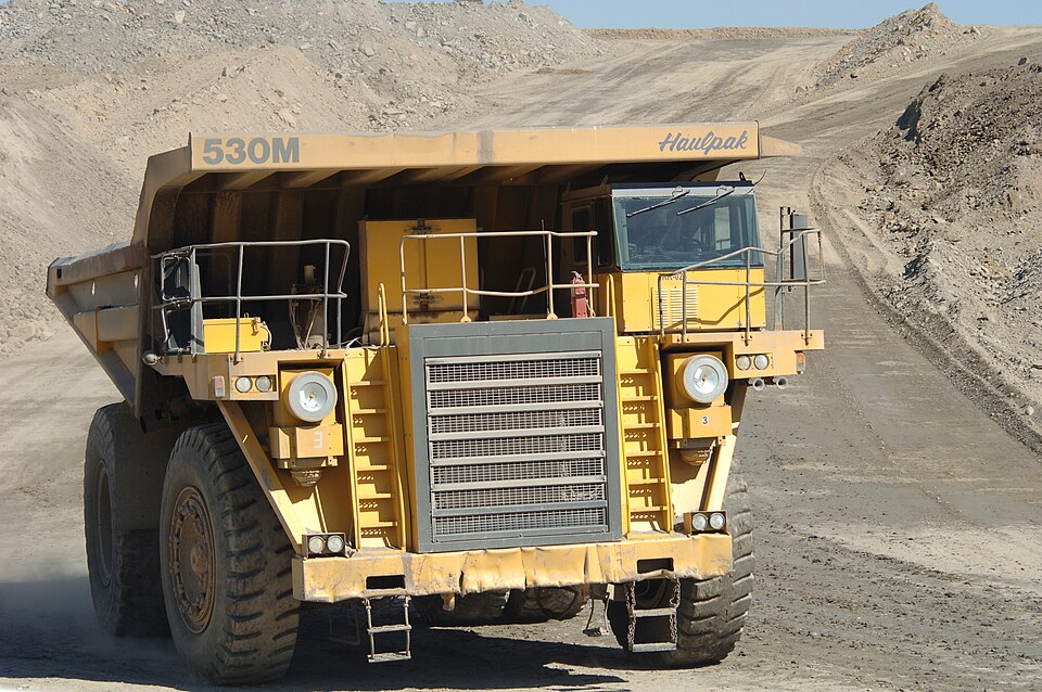 Large haul truck operating at an open-pit mine
